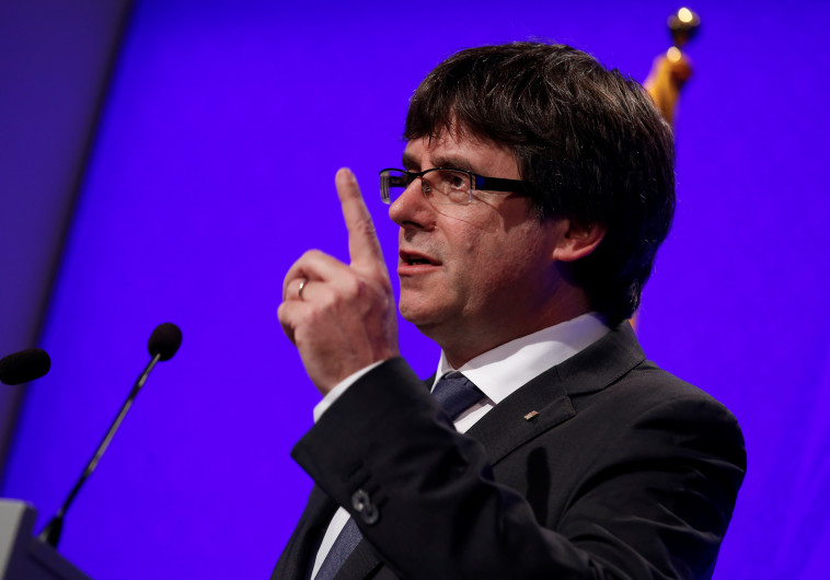 בין הפטיש לסדן. קרלס פוג'דמון, צילום: רויטרס