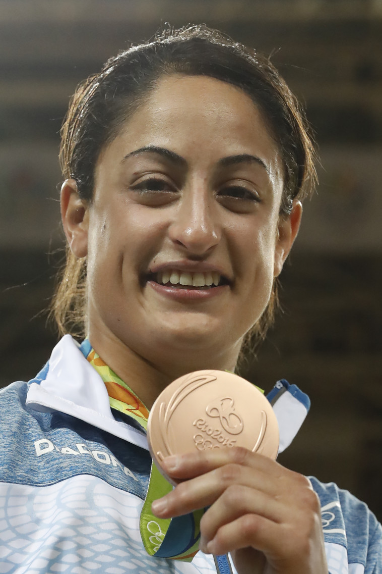 ג'רבי עם המדליה. &quot;נתתי את הנשמה וזה השתלם&quot;. צילום: AFP