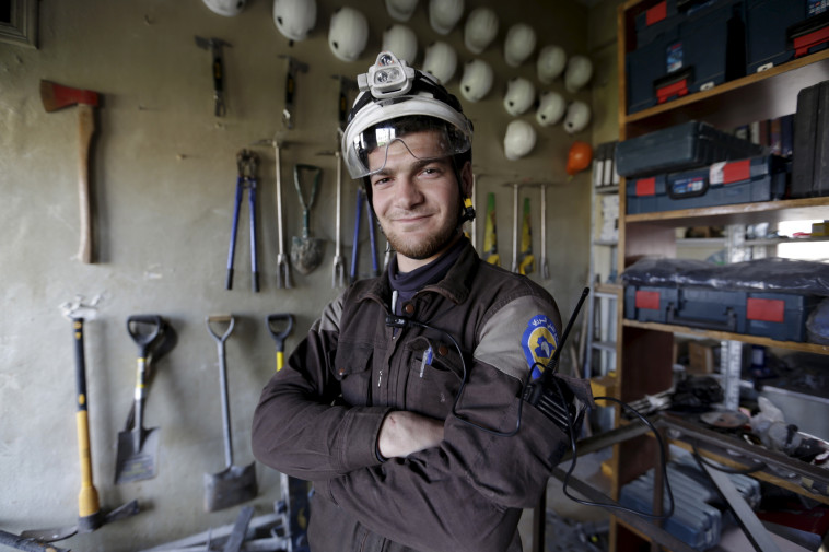 עומאר אולוואן, אחד ממתנדבי הארגון. צילום: רויטרס