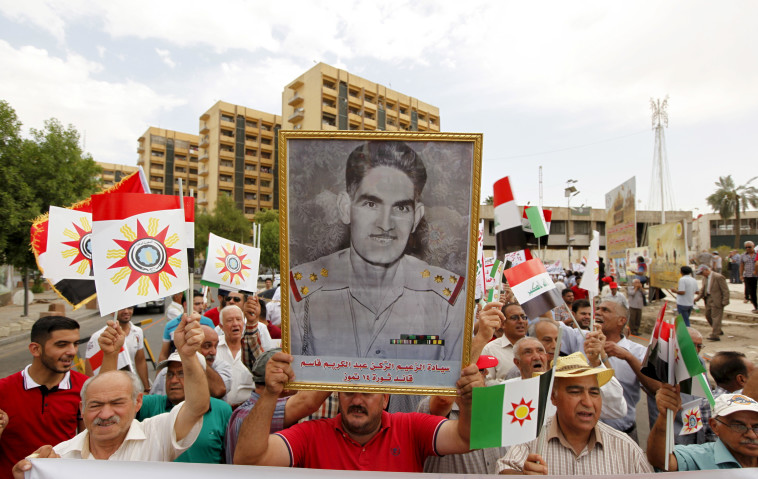 תמונתו של עבד אל-כרים קאסם בבגדד. &quot;חשבו שהחבאתי אותי אצלי בשיא המהפכה נגדו&quot;. צילום: רויטרס