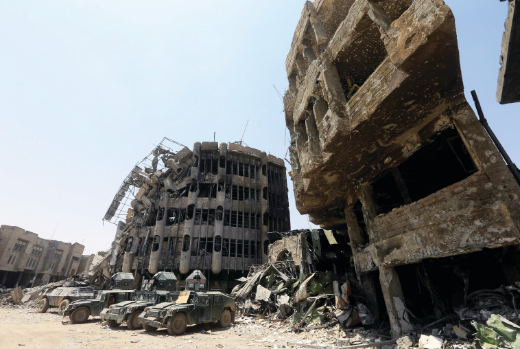 מוסול. עם פלישתם לעיר לוחמי דאעש השתלטו על בסיס בעיר שבו היו חומרים לבניית פצצה רדיואקטיבית. צילום: רויטרס