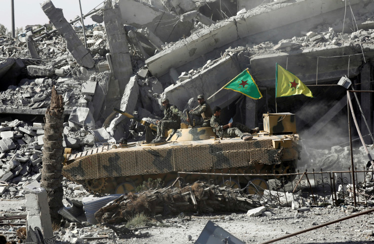 הכוחות הדמוקרטיים הסוריים משחררים את א-רקה. צילום: רויטרס