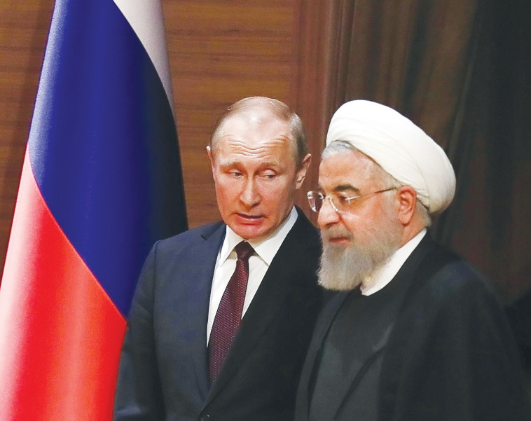 פוטין וחמינאי. המסר הועבר. צילום: AFP פוטין וחמינאי. המסר הועבר. צילום: AFP