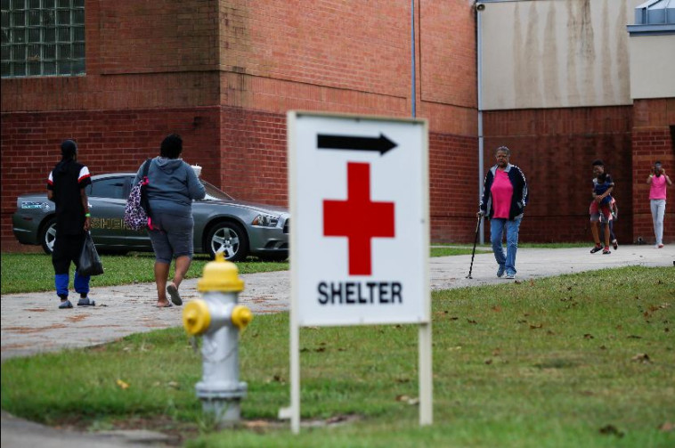 אנשים מתפנים למקלטים בוושינגטון. צילום: רויטרס