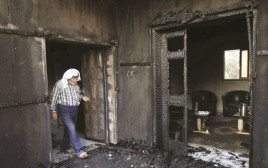 בית משפחת דוואבשה לאחר הפיגוע (צילום: רויטרס)