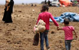 פליטים סורים מאזור דרעא (צילום: רויטרס)
