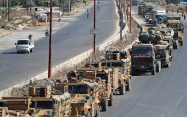 שיירה  טורקית בדרך לחאן שייח'ון (צילום: OMAR HAJ KADOUR/AFP/Getty Images)