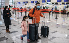השפעות נגיף הקורונה בשדה התעופה (צילום: NICOLAS ASFOURI\AFP via Getty Images)