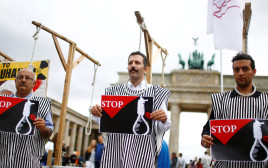 מחאת איראניים נגד ההוצאות להורג במדינתם (צילום: REUTERS/Hannibal Hanschke)