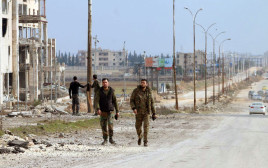 חיילי צבא סוריה (צילום: SANA/Handout via REUTERS)