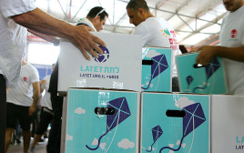 חלוקה לנזקקים (צילום: ארגון לתת)