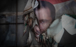 פוסטר של בשאר אל-אסד (צילום: Burak Kara/Getty Images)