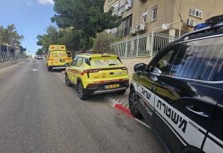 ניידת מד"א ומשטרה בקריית אתא (צילום: תיעוד מבצעי מד"א)