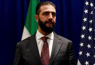 אחמד א-שרע (אל-ג'ולאני) (צילום: REUTERS/Bing Guan/Pool)