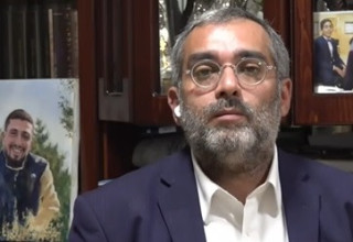 הרב אלחנן דנינו (צילום:  צילום מסך כאן 11)