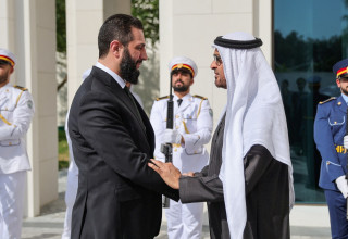 עבדאללה בן זאיד אאל נהיאן, אחמד אל שרע (צילום: Syrian Presidency/Handout via REUTERS)