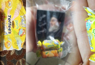 טופי ישראלי חולק ביחד עם מגנטים הנושאים את תמונת נסראללה (צילום: רשתות ערביות)