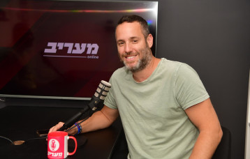 יותם זמרי שדרן ומגיש בערוץ 14 (צילום: אבשלום ששוני)