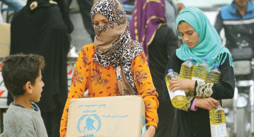 נשים מקבלות סיוע במזון מהארגון, ארכיון (למצולמות אין קשר לנאמר בכתבה) (צילום: רויטרס)