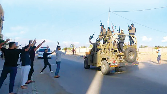 פעילי חמאס  ב-7 באוקטובר (צילום: עטיה מוחמד, פלאש 90)