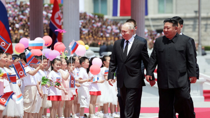 ולדימיר פוטין, קים ג'ונג און (צילום: Sputnik/Gavriil Grigorov/Pool via REUTERS)