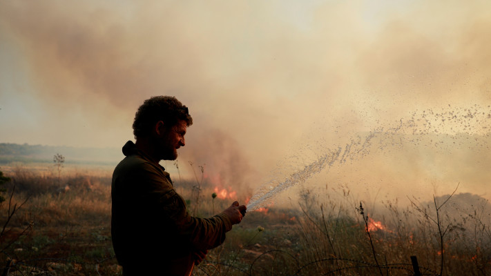 שריפות בצפון (צילום: REUTERS/Ammar Awad)