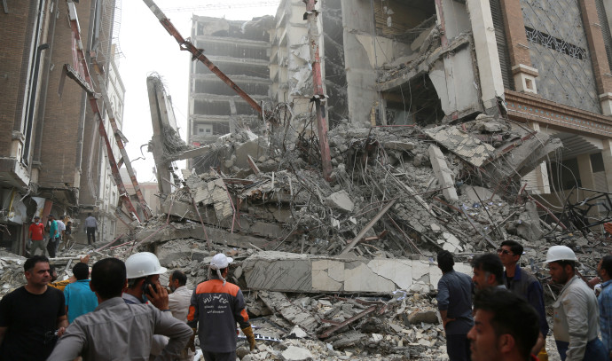 Five were killed and another 80 were trapped in a building collapse in Iran