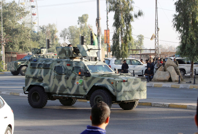 רכב משוריין של צבא עיראק בקירקוק (צילום:  רויטרס)