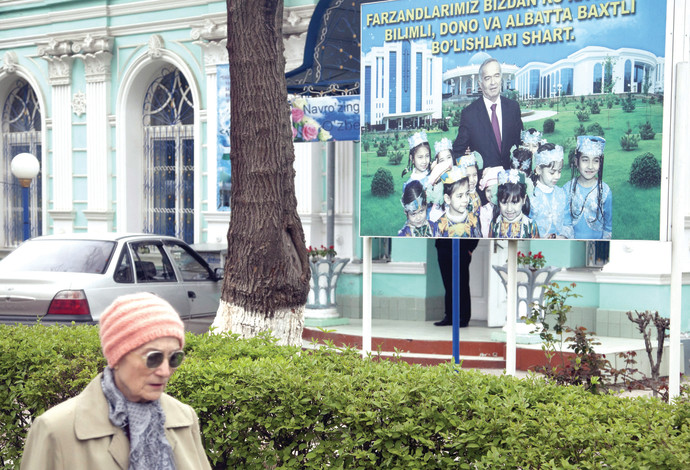 שלט בחירות של קרימוב בטשקנט, אוזבקיסטן (צילום:  רויטרס)