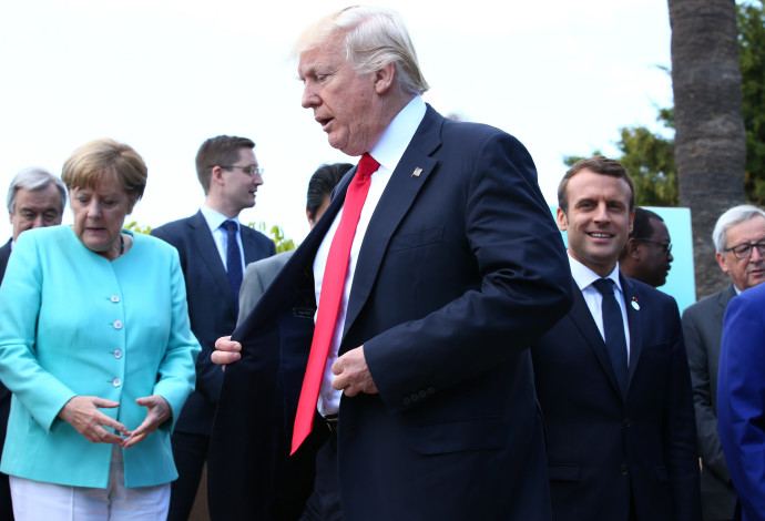 דונלד טראמפ ואנגלה מרקל בפסגת ה-G7 (צילום:  רויטרס)