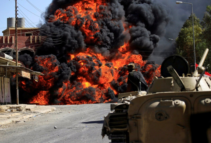 לחימה בין הצבא העיראקי לדאעש בתל עפאר (צילום:  רויטרס)