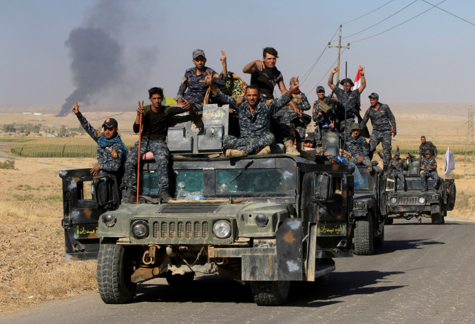 אנשי כוחות הפדרליים של עיראק סמוך לכירכוכ (צילום:  רויטרס)