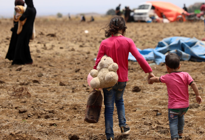 פליטים סורים מאזור דרעא (צילום:  רויטרס)