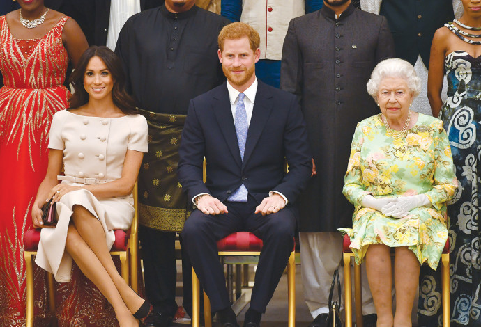 המלכה אליזבת, הנסיך הארי, מייגן מרקל (צילום:  AFP)
