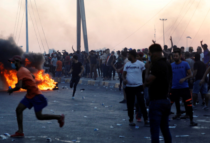 ההפגנות האלימות בעיראק (צילום:  רויטרס)