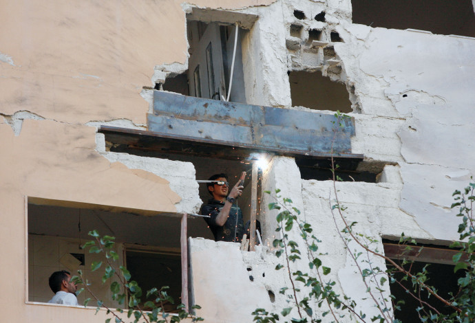 בניין בדמשק שנפגע מתקיפת צה"ל (צילום:  רויטרס)