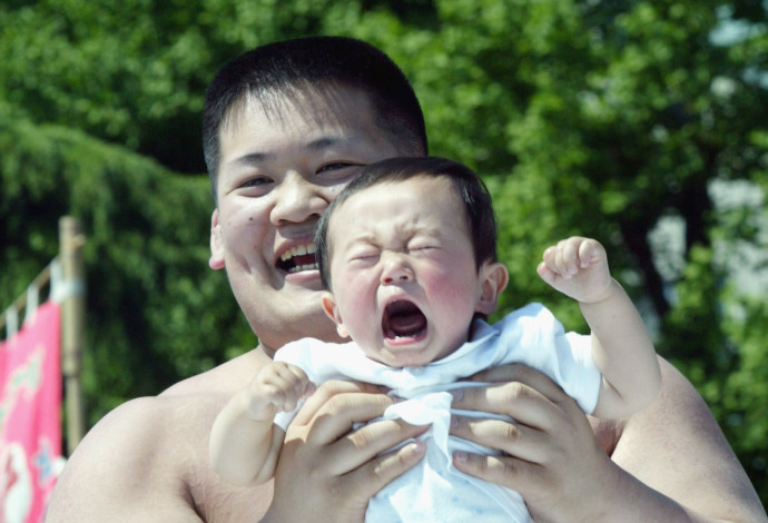 תינוק בוכה  (צילום:  Koichi Kamoshida/Getty images)