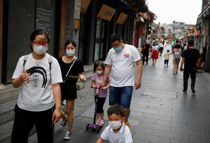 קורונה בסין  (צילום:  REUTERS/Thomas Peter)