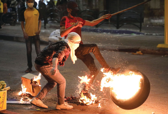  מתפרעים בחברון, השבוע (צילום:  HAZEM BADER/AFP via Getty Images)