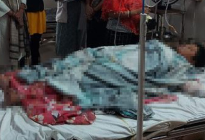 קומארי, כשעוד הייתה בחיים במיטת בית החולים (צילום:  צילום מתוך טוויטר)