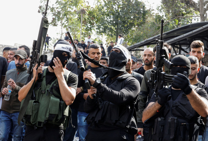 ארגון הטרור גוב האריות (צילום:   REUTERS/Raneen Sawafa)
