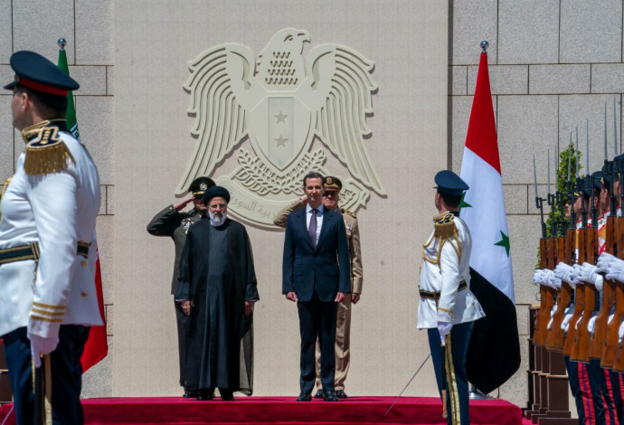 נשיא סוריה בשר אסד ונשיא איראן איברהים ראיסי (צילום:  Handout via REUTERS)