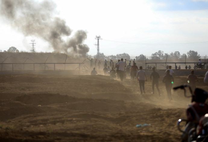 פריצת גדר המערכת ברצועת עזה בשבעה באוקטובר (צילום: רויטרס)