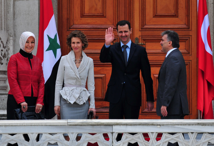 בשאר אסד ורעייתו אסאמא (צילום:  AFP via Getty Images)