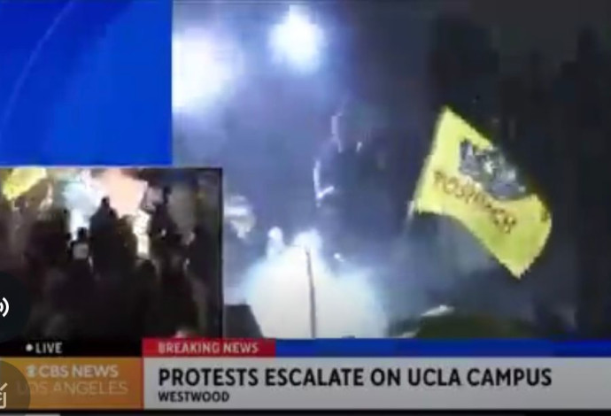 הדגל הצהוב של חב"ד עם שיבוש המילה "משיח" בהפגנה בלוס אנג'לס (צילום:  רשתות חברתיות, שימוש לפי סעיף 27 א',צילום מסך רשת X)