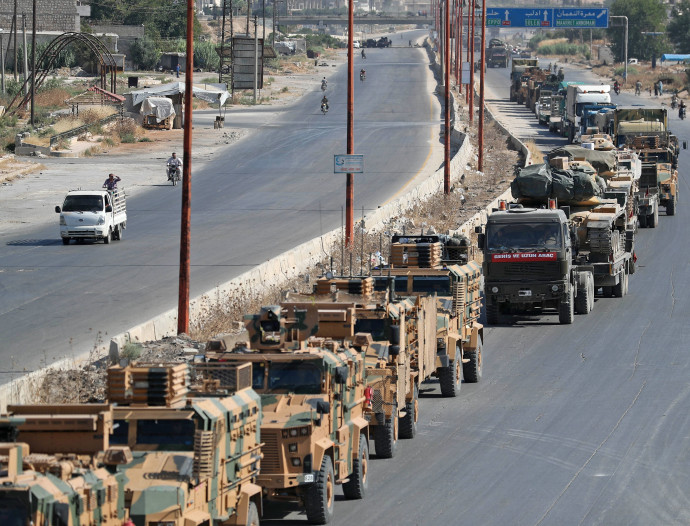שיירה  טורקית בדרך לחאן שייח'ון (צילום: OMAR HAJ KADOUR/AFP/Getty Images)