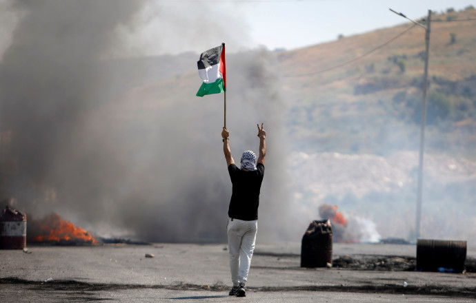 פלסטינים בהפרות סדר ביהודה ושומרון (צילום: REUTERS/Raneen Sawafta)