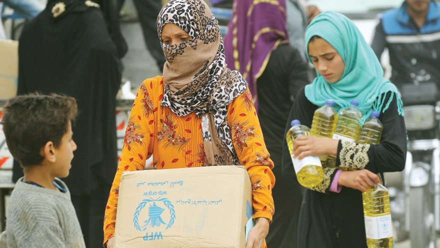 נשים מקבלות סיוע במזון מהארגון, ארכיון (למצולמות אין קשר לנאמר בכתבה)