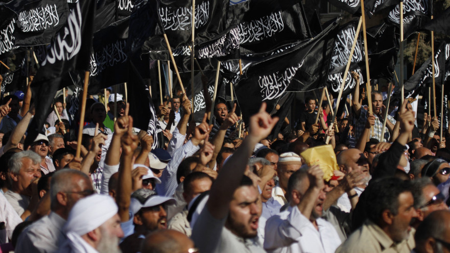 פלסטינים בהפגנת תמיכה ב"חזב א-תחריר"