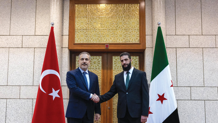 שר החוץ הטורקי הקאן פידן ומנהיג המורדים בסוריה אל ג'ולאני